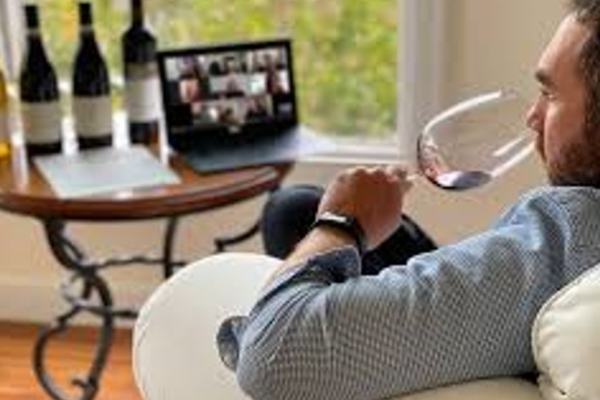 Man attending virtual wine tasting